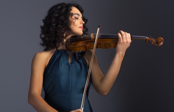 Alena Baeva with a violin